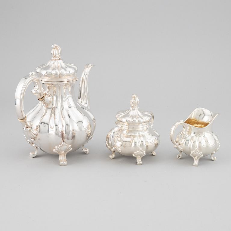 A 20th century silver coffee pot, creamer and sugar bowl. Swedish import mark.