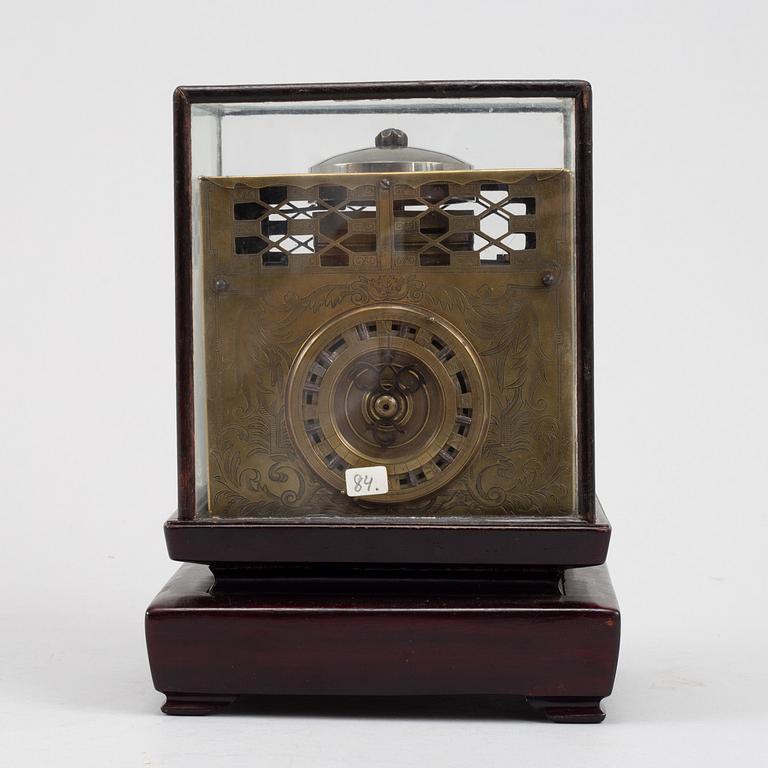 A Japanese brass mantel clock, 19th Century.