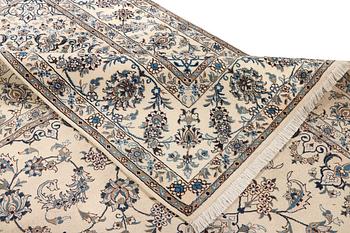 A Nain, part silk carpet, c. 337 x 244 cm.