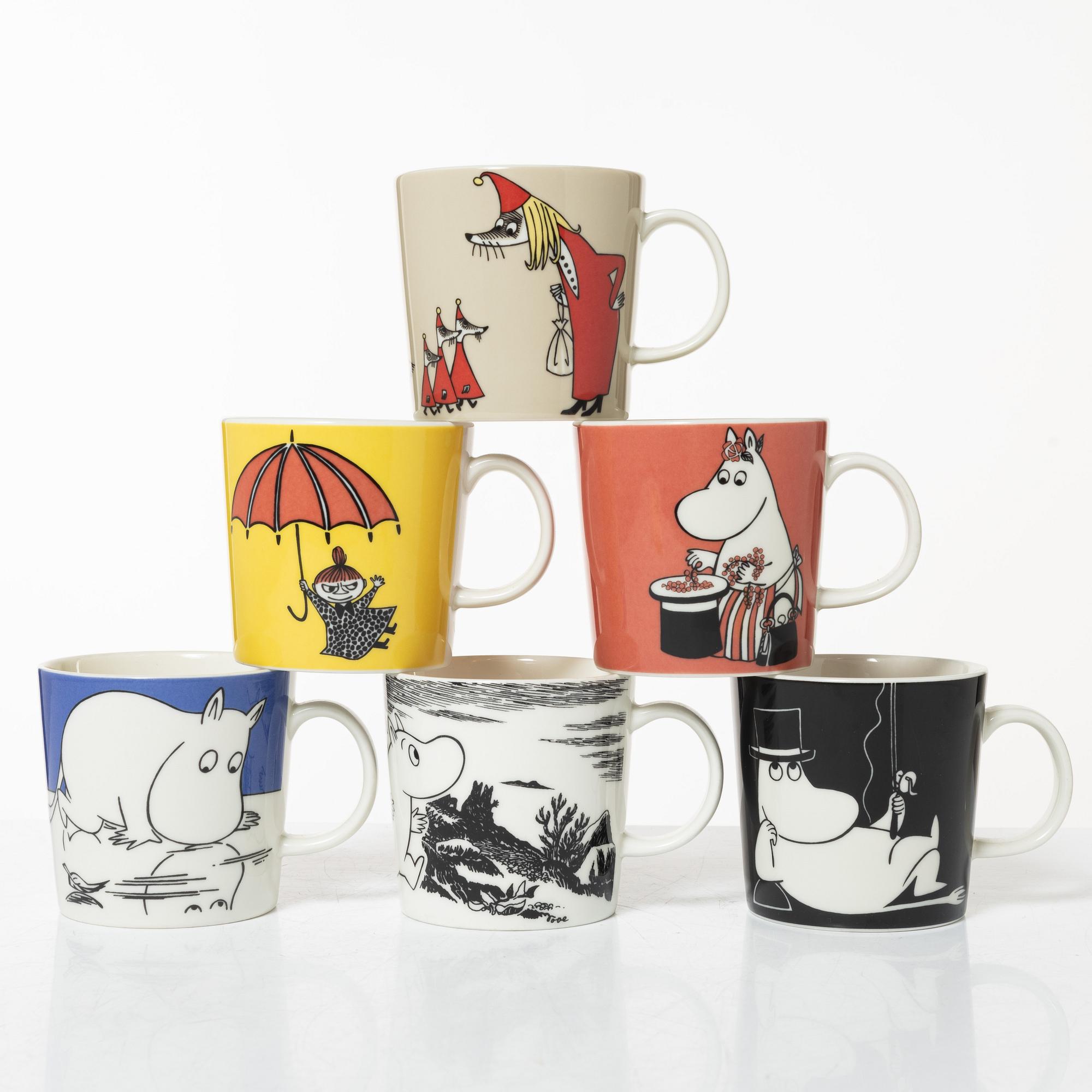 A set of 24 Moomin mugs, Arabia, Finland.