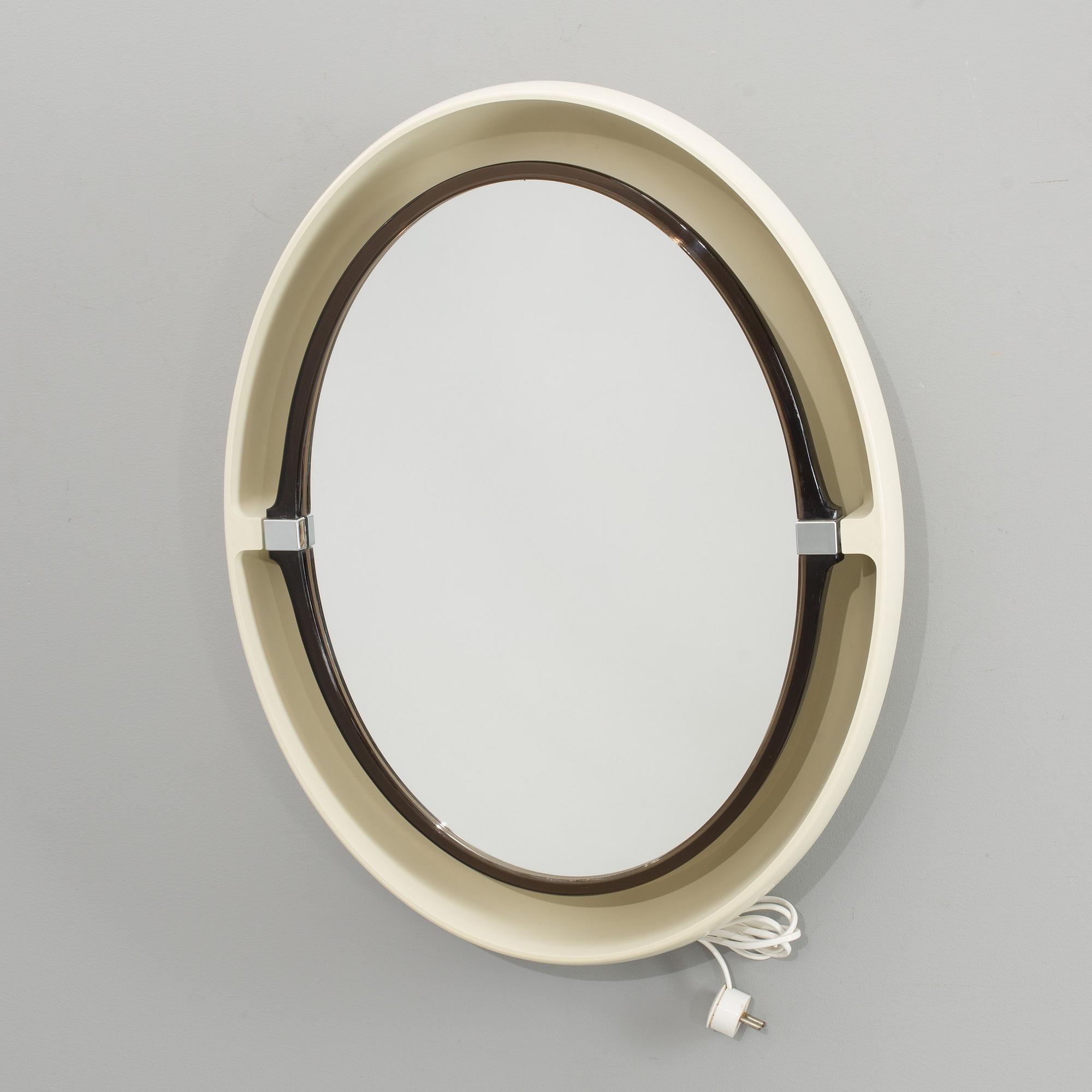 A "SPACE AGE" WALL MIRROR WITH LIGHT BY ALLIBERT, 1970´s.