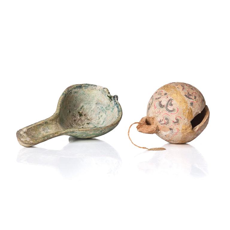 A painted pottery bell and a green glazed spoon, Han dynasty  (202 BC-220 AD).