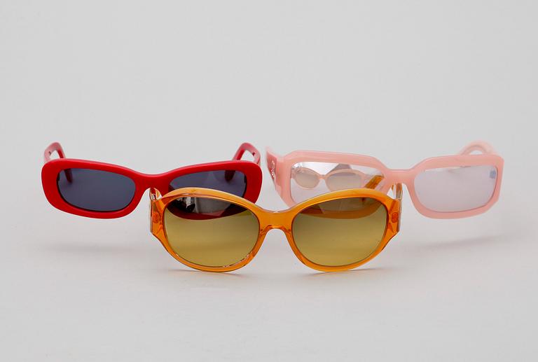 A set of three sunglasses by Chanel.