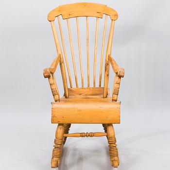 A Wooden Rocking Chair.