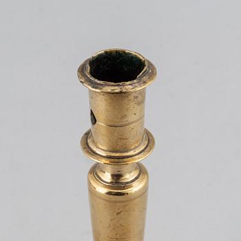 A 17th century bronze candlestick.