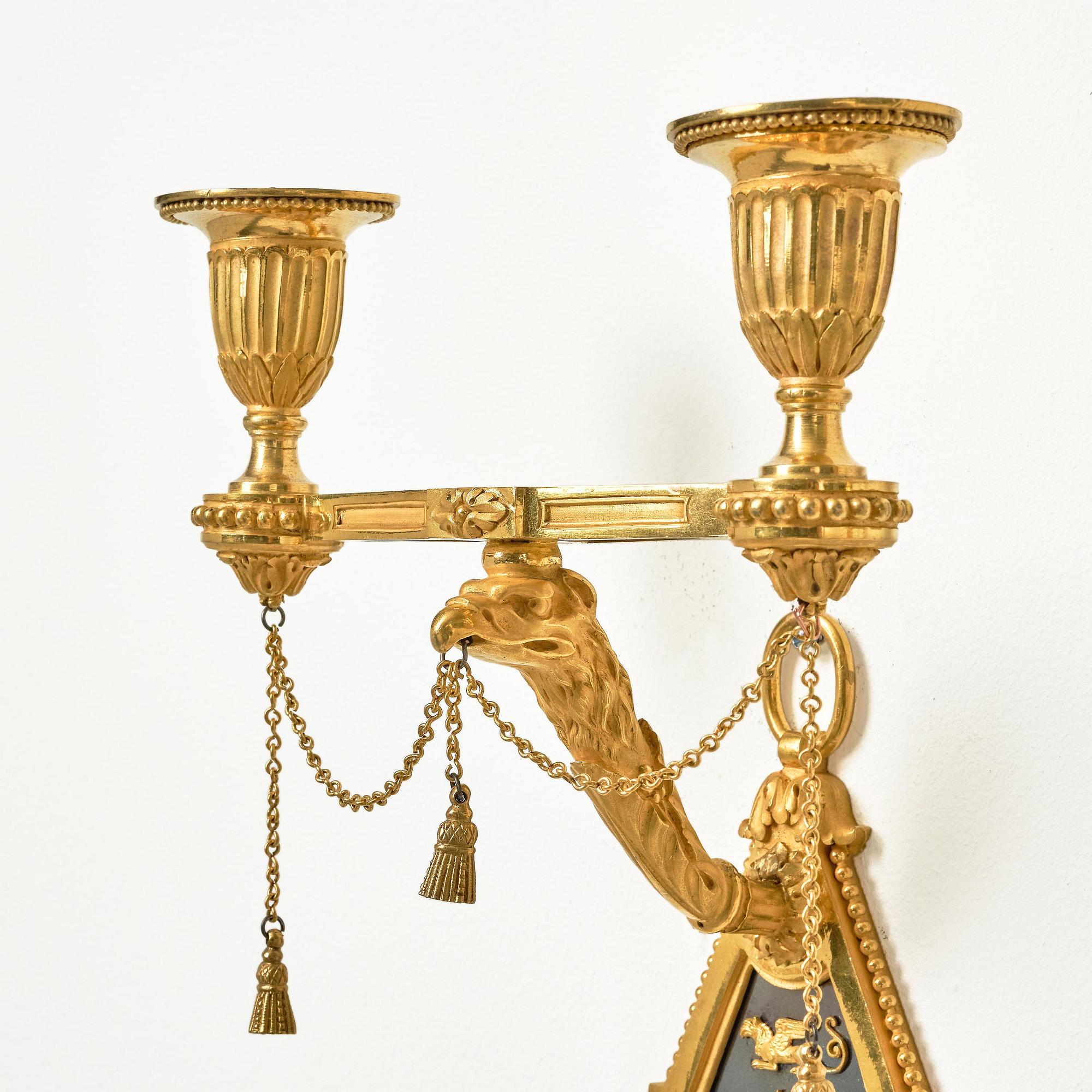 A pair of two-branch late Louis XVI ormolu and blued steel appliques attr. to F. Rémond (bronzier in Paris 1774-1812).