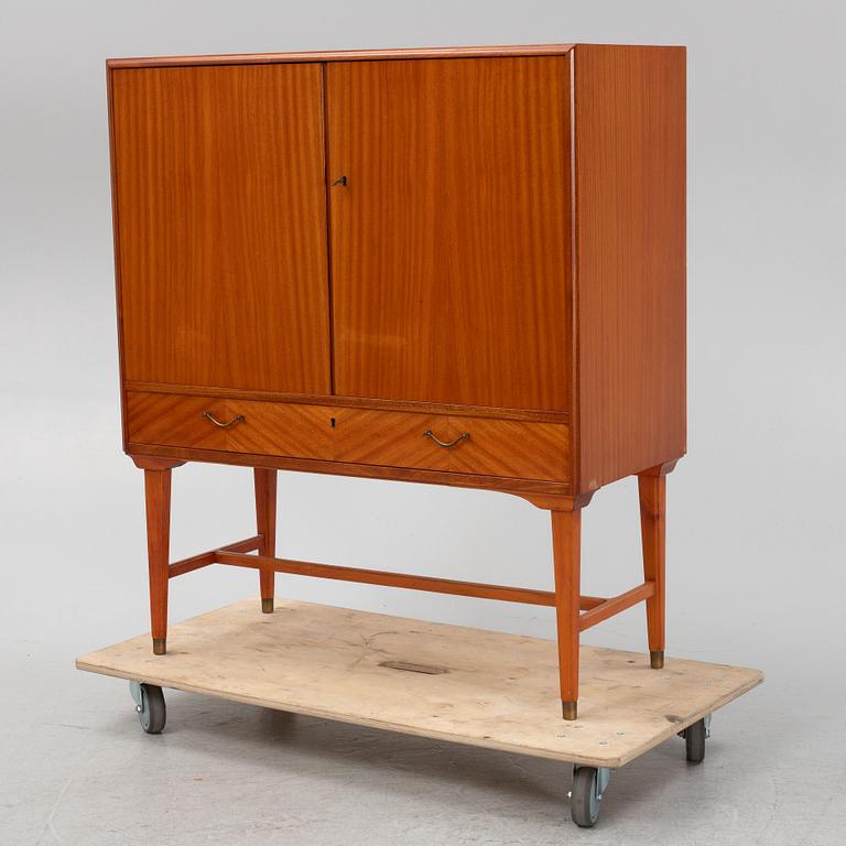 A mahogany veneered cabinet, 1940s/50s.
