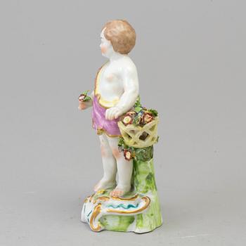 A Samson porcelain figure of a boy with flowers, Paris, France circa 1900.