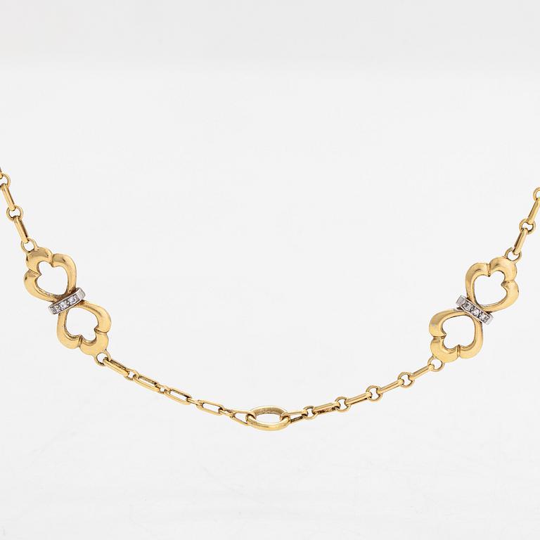 An 18K gold necklace, with diamonds totalling approx. 0.12 ct. Foreign hallmarks.