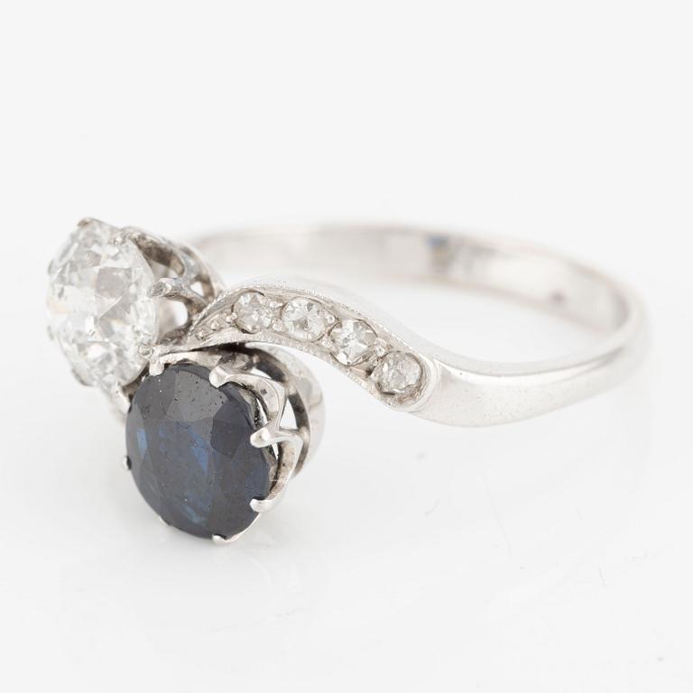 Ring, sibling ring, 18K white gold with dark sapphire and diamonds.