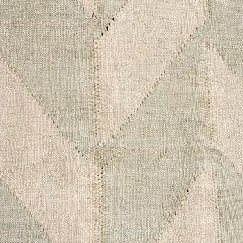 A flatweave rug, 307 x 250 cm.