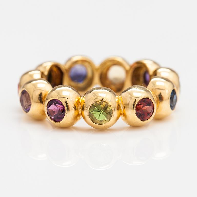 An 18K gold ring with different gemstones. Ofelia Jewelry, Helsinki.