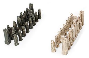 A Tore Strindberg (1882-1968) set of 32 pewter and metal chess pieces, Herman Bergman, Stockholm.