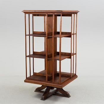 An early 20th century turning book shelf.