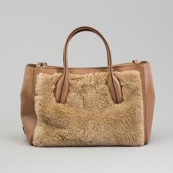 A leather and cbag by Tod'sastor.