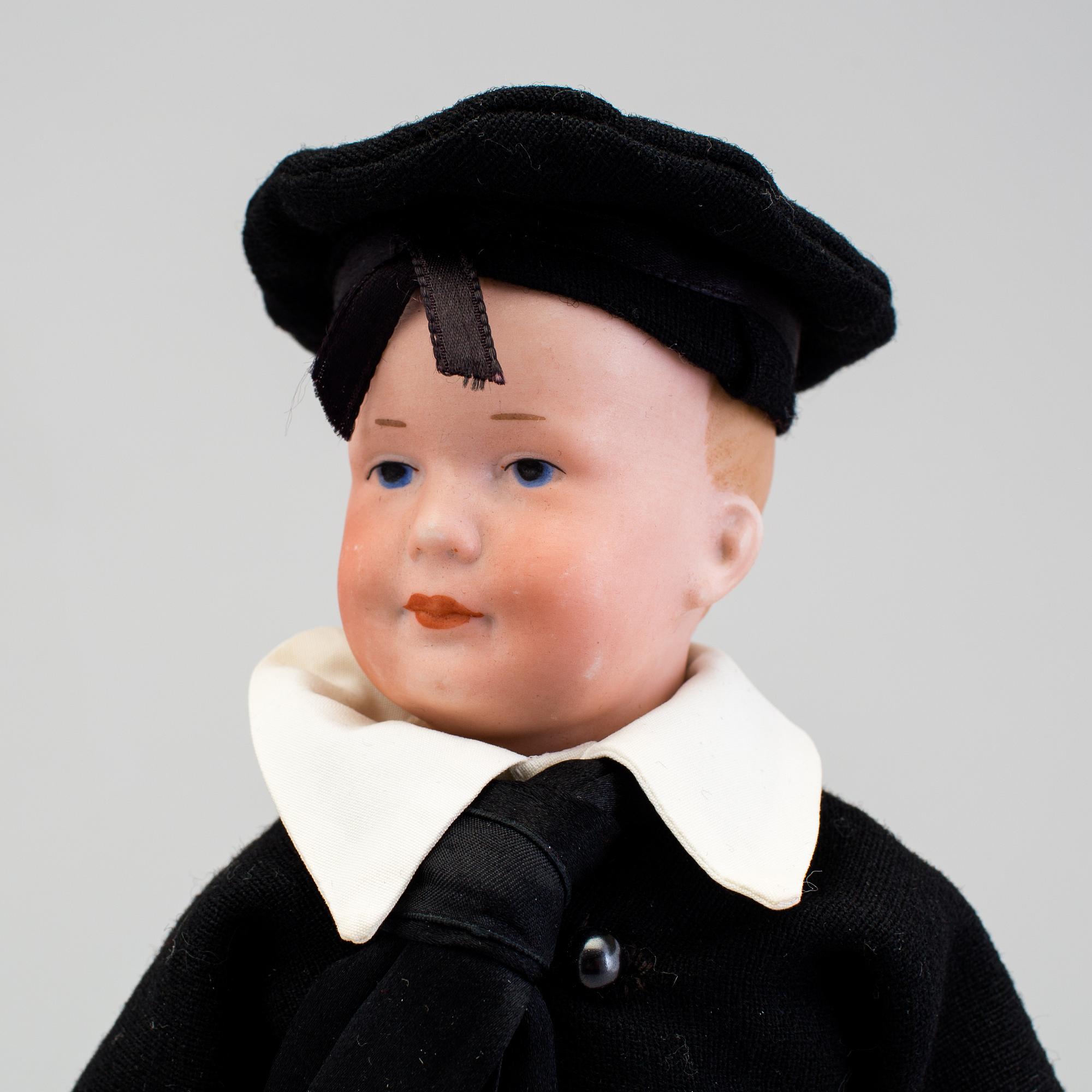 A bisque headed character doll 500 by Armand Marseille, Germany, ca 1910.