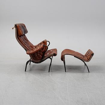 Bruno Mathsson,
fåtölj , "Pernilla 69" med fotpall, DUX, 1900-talets andra hälft.