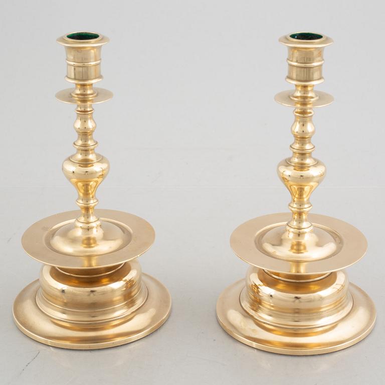 Two pairs of brass candlesticks, 19th century - early 20th century.