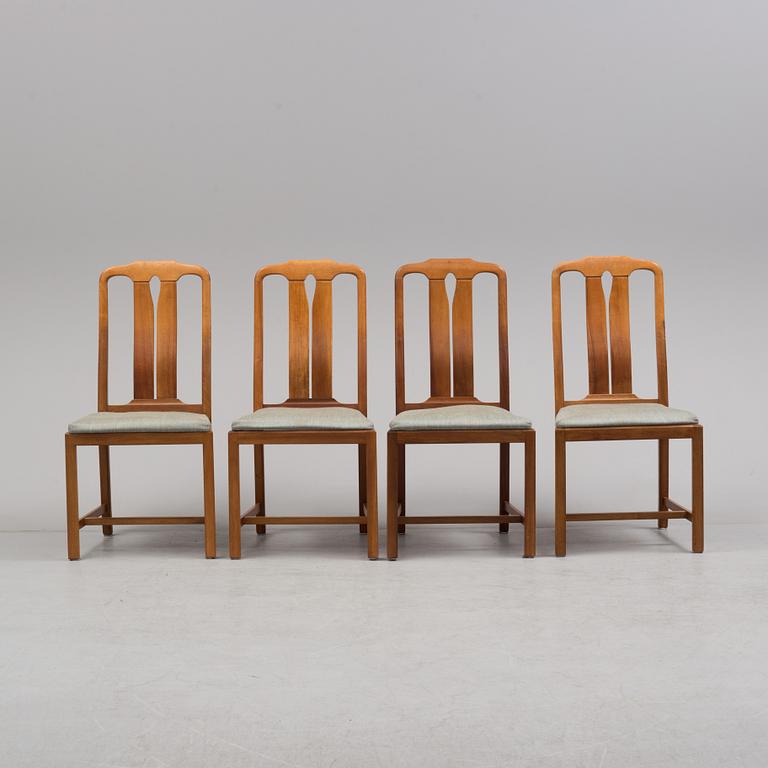 A Carl Malmsten "Ambassadör" dining table and four chairs  , second half of the 20th century. One extension leaf.