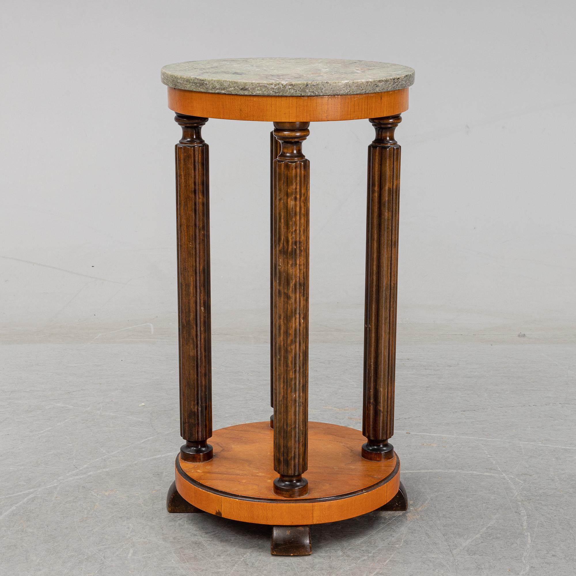 A stone top pedestal, 1920's/30's.