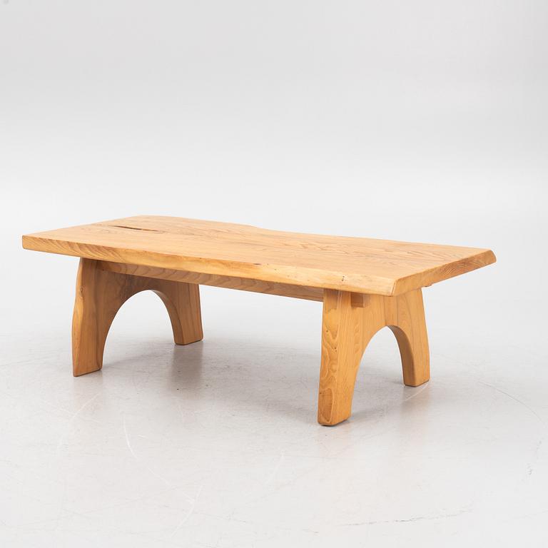 A sold elm coffee table, Söwe Konst, Sweden, dated 1977.