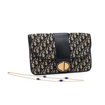 623. CHRISTIAN DIOR, a monogram canvas clutch bag and necklace.