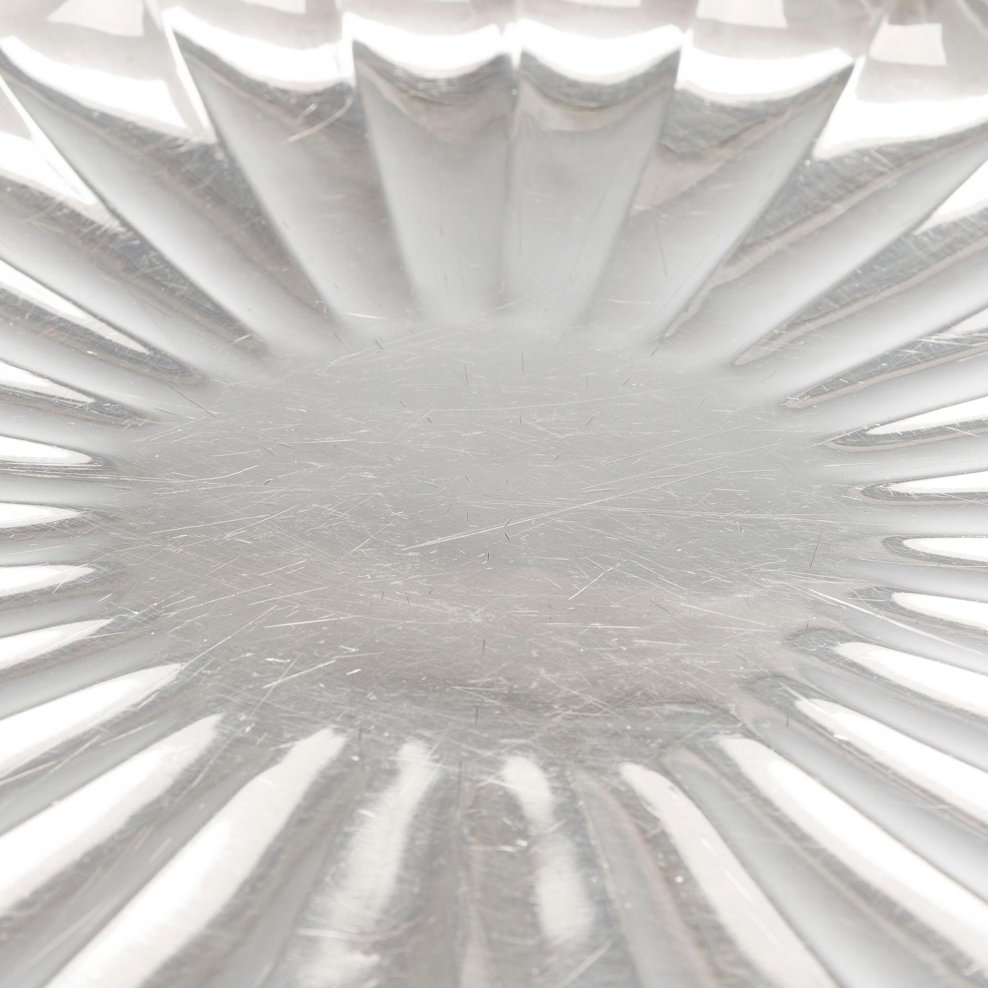 A Japanese chrysanthemum-shaped silver centerpiece dish, mark of late Meiji-period (1868-1912).