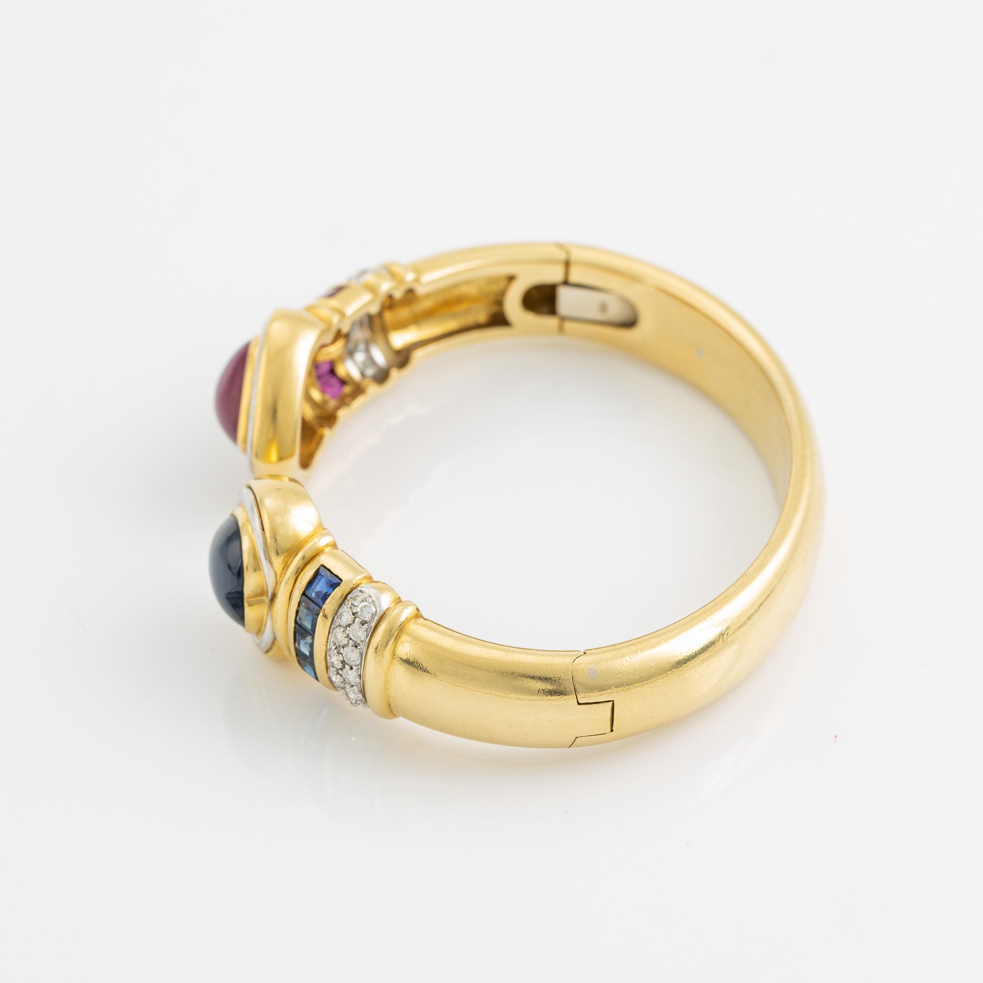 Heart shaped ruby and sapphire and brilliant cut diamond bangle.