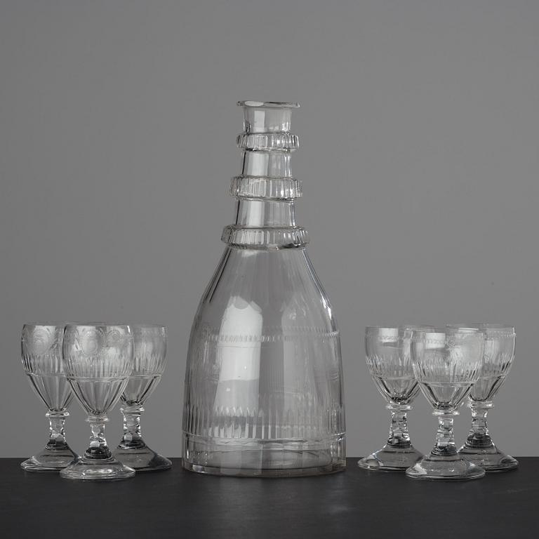A large bottle and six glasses, Sweden, Reijmyre glassworks, circa 1810. Engraved by Anders Spolander.