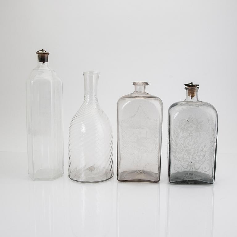 A set of four 19th/20th century glass decanters.