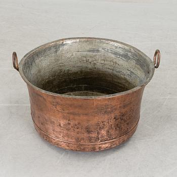 A 19th century copper cauldron.