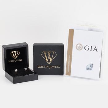 Brilliant-cut diamond stud earrings.