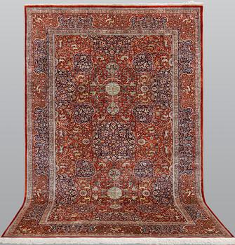 A pictoral orietal silk rug, 246 x 153 cm.