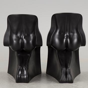 a pair of Italian black plastic chairs designed by Fabio Novembre "Him" and "Her" from the late 20th Century.
