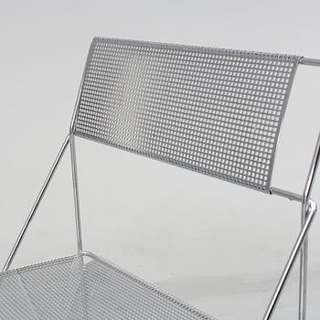 8 contemporary stackable metal chairs.