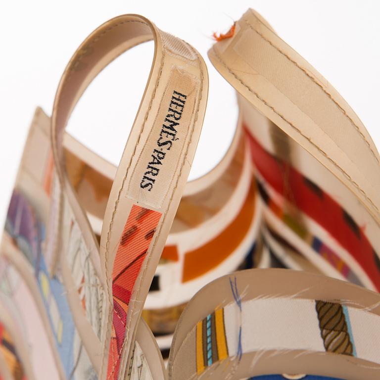 A PLASTIC AND SILK TOTE BAG.