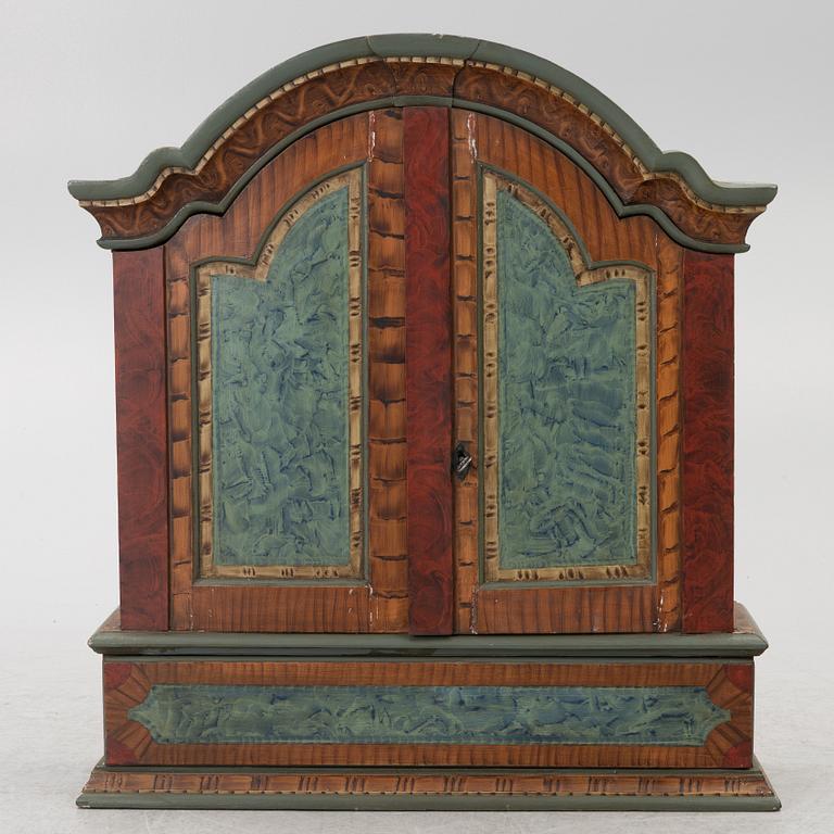 A folk-art cabinet from Värmland, Sweden, dated 1806.
