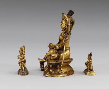 A set of three gilt bronze figures, one of Kuwera and two of Buddha, Qing dynasty, 18th/19th Century.