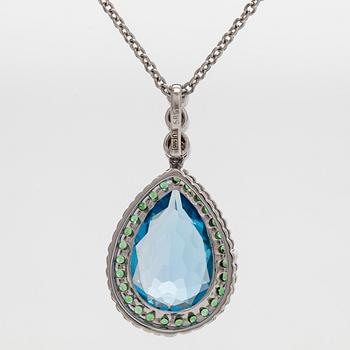 A 14K white gold necklace with pendant, topaz, brown diamonds.