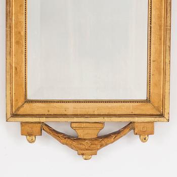 An early 20th century gustavian style mirror.