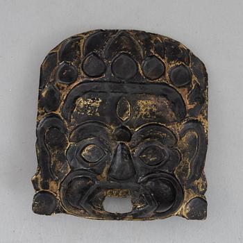 A stone inlay mask, Nepal, early 20th century.