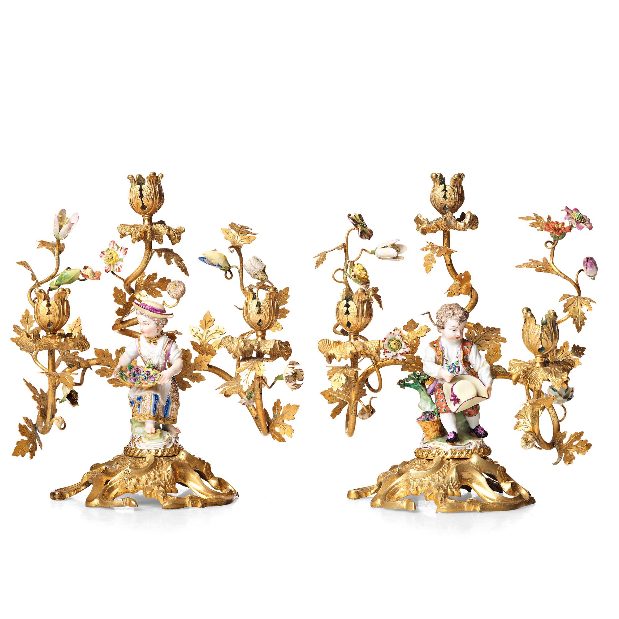 A pair of Meissen Rococo-style three-light candelabra, second half of the 1800's.