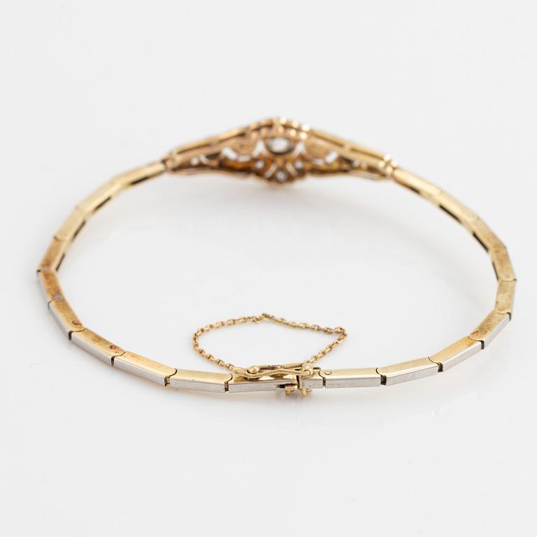A 14K gold and platinum bracelet set with old- and rose-cut diamonds and pearls.