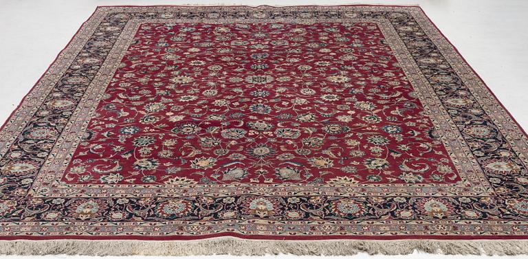 An oriental carpet, a. 378 x 278 cm.