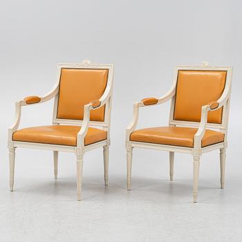 A pair of Gustavian style armchairs, end of the 20th Century.