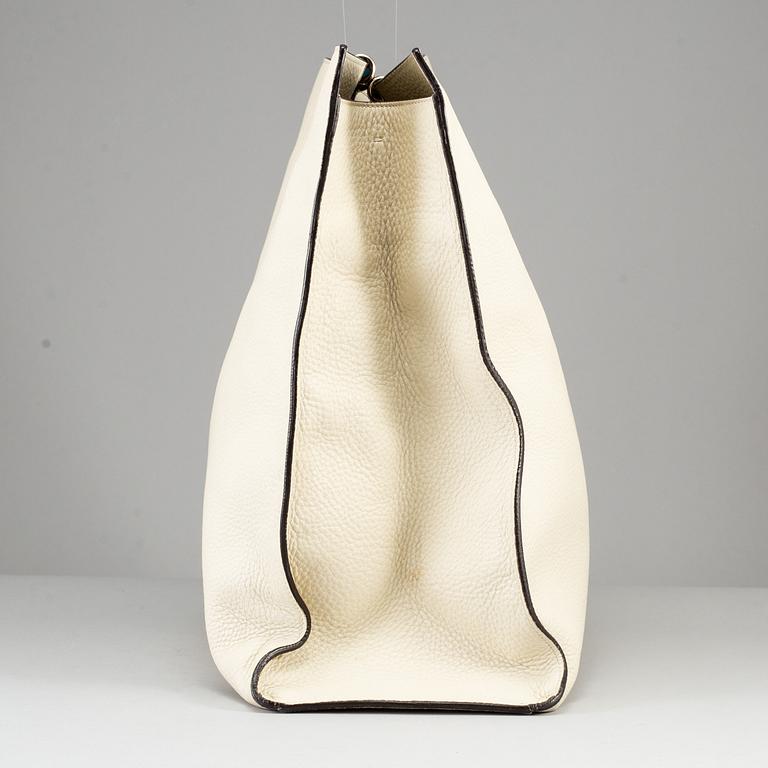 GUCCI, a white leather tote bag with bamboo handles.