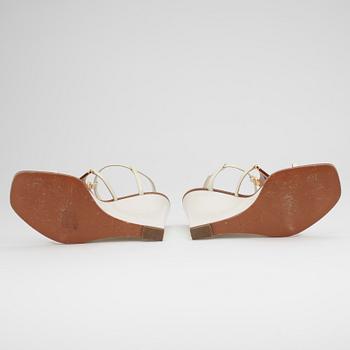 LOUIS VUITTON, a pair of white wedge heel sandalettes.