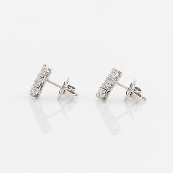 Brilliant-cut diamond earrings.