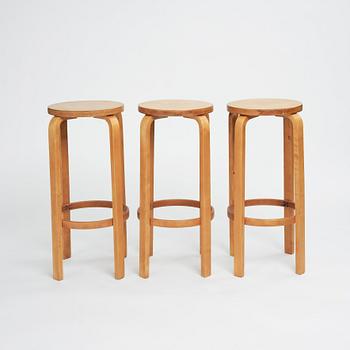 Alvar Aalto, a set of three bar stools, model "64", Finmar Ltd, Finland 1930s.