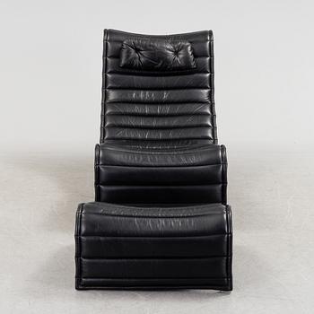 ERIC SIGFRID PERSSON, a leather upholstered lounge chair and foot stool from Möbelkultur AB.
